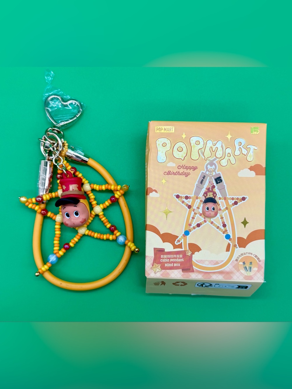 Popmart pendant with charging cable